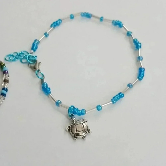 Bundle of 3. 1 bracelet.1 ankle bracelet  plus a silver n teal Skull necklace. - Picture 2 of 3